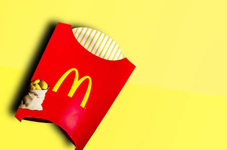 Bangkok, Thailand: McDonald's French fries in the French fries box on red background. McDonald's Corporation is the world's largest fast food restaurant - 04 May 2020のeditorial素材
