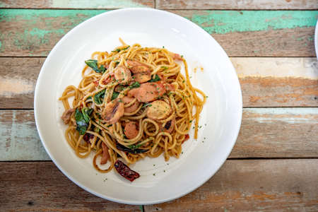 Spaghetti, food, street, asia, delicious, bacon, sausage on the wood floor, photo jpgの写真素材