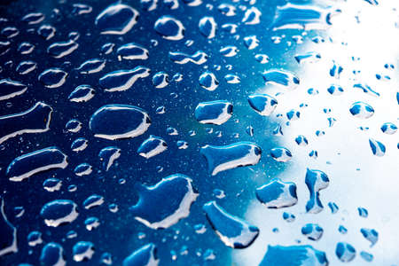 Water droplets on the mirror surface naturally clean water.の写真素材