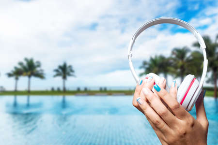 Woman hand holding the headset White technologyの写真素材