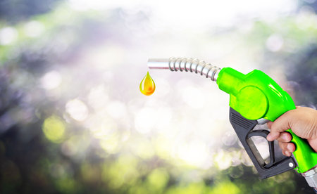 Fuel nozzle Hand holding Oil extracted from the background, clipingpartの写真素材