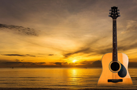 Wooden guitar on the sea surface, sunrise, musical instruments with nature, background music on a beautiful sea day, relaxation, music and national music.
Photo ideasの写真素材