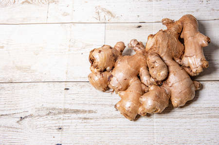 Ginger on wood floor background Ginger Mini Tientsin Pakchoi Ginger on white background Organic...