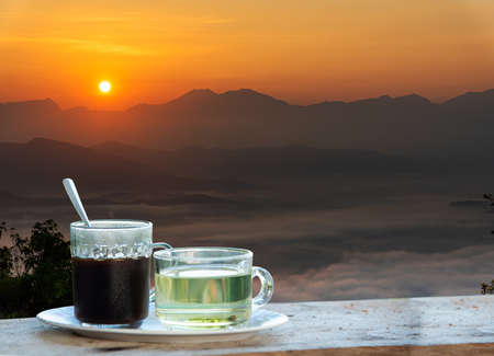 Hot coffee, tea Natural, mountain view, morning sunriseの写真素材