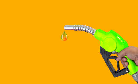Fuel nozzle Hand holding Oil extracted from the background, clipingpartの写真素材