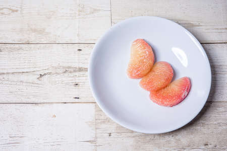 Golden Grapefruit Tree Pink shrimp meat, sweet and juicy taste, blooming on the wooden floor, fruit,...