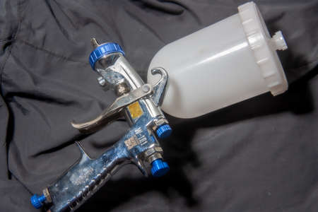 Tattoo machine on a black background. Tattoo concept.