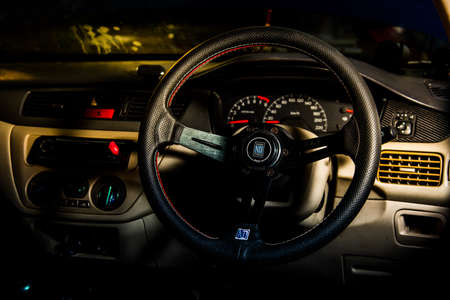 The interior of a modern car. Steering wheel and dashboard.