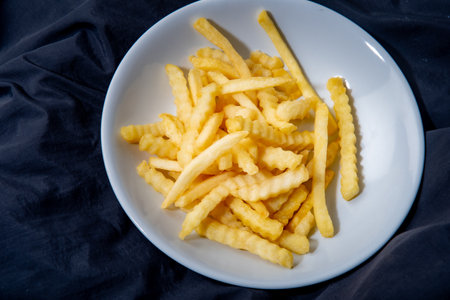 French fries in a plate French fries in a plate. on a dark backgroundの写真素材