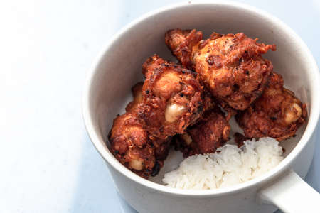 Fried chicken, steamed rice, Asian street food, on backgroundの写真素材