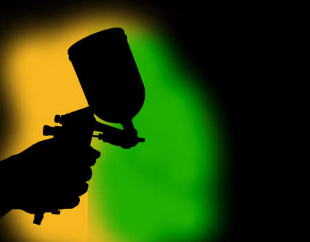 Black shadowHand holding paint spray gun Paint spray on floors Image of the painter's arm hand holding industrial size spray gun used for industrial painting and coating and isolated on background clipingpartの写真素材