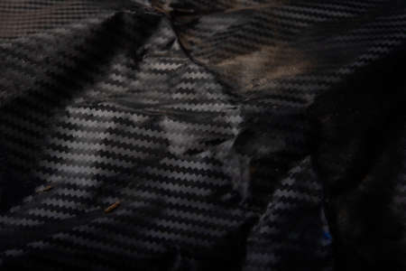 Kevlar Carbon fiber composite raw material background uneven wallpaper technologyの写真素材