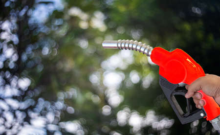 Fuel nozzle Hand holding Oil extracted from the background, clipingpartの写真素材