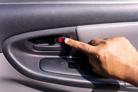 The hand of a man holding the hand to open the car door