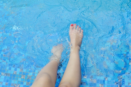 Legs relaxing and poolの写真素材