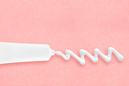 Tube with cosmetic cream on pastel backgroundの写真素材