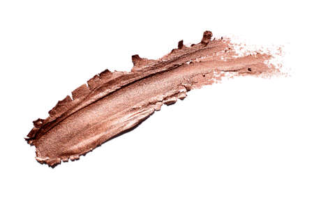 Smear of gold matte metallic lipstick or creamy eye shadow isolated on white background cosmetic...