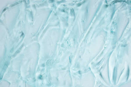 Gel serum texture with transparent on white background by focused on microscopeの写真素材