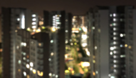 Blurred abstract background - Night aerial view of modern residential apartment(HDB) in Singaporeの写真素材
