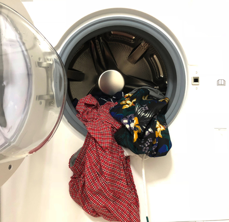 cleaned laundry fall out from washing machine