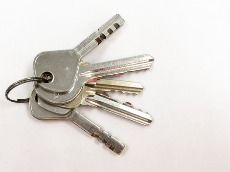 Bunch of keys on white backgroundの写真素材