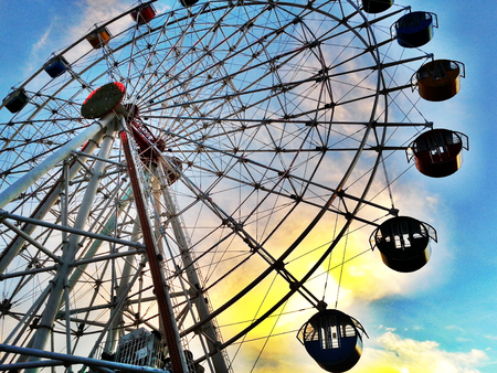 macro view of ferris wheel during sunsetの写真素材