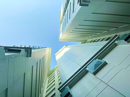 worm's eye view of residential apartments architecture that resembles triangle