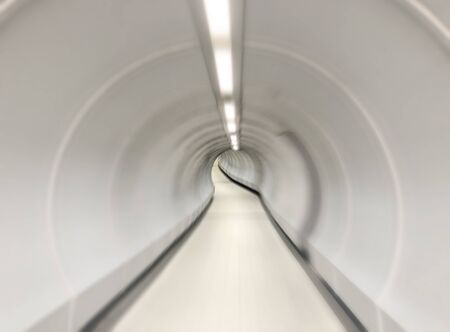 Abstract motion blur image of futuristic looking tunnel with bright light