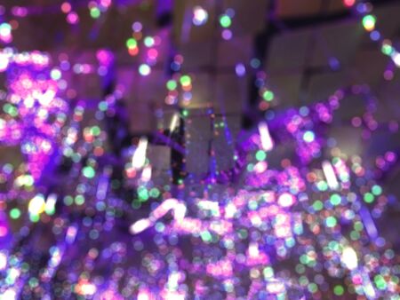 Colorful glittering Christmas lightings Bokeh backgroundの写真素材
