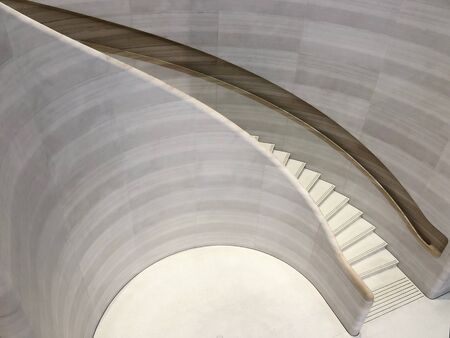Curvy/ round/ circle/ spiral staircase with clean aesthetic and minimalist designsの写真素材
