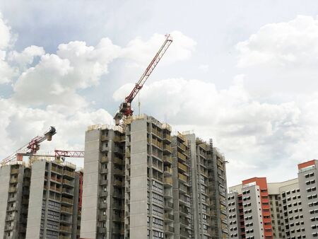 Blocks of Buildings under construction with cranes