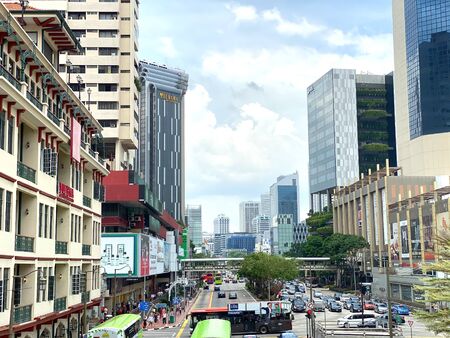 Singapore: 20 October 2019 - Singapore Chinatown Street view with heavy traffic from overhead pedestrian bridgesの写真素材