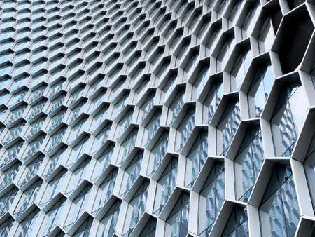 Singapore - Feb 15 2020: Abstract view of the beehives facade of the Duo Residences on Beach Road, a new iconic 49-storey residential tower in the heart of Bugis and the CBD of Singaporeのeditorial素材