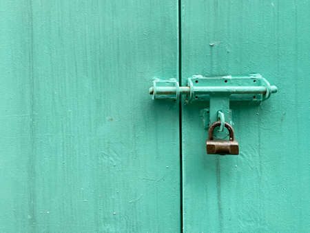 Antique door lock with tiffany blue wooden door
