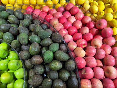 Wide selection of fruit display apple avocado lemon