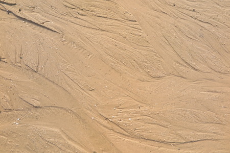 Texture  water streak on sand the beach
