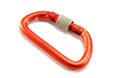 Old red aluminium alpinist carabiner isolated on white backgroundの写真素材