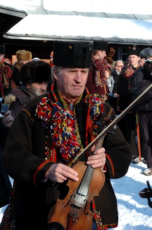 Kryvorivnya,Ukraine ,January 7,2008- Gutsuls (highlanders in Carpathian mountains) are singing...