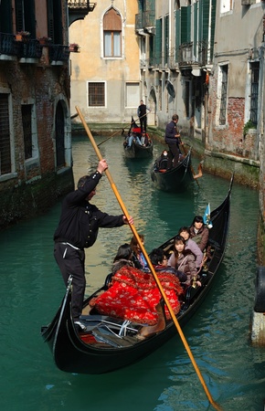 Venice,Italy, March 11,2011-Hard traffic at Venice canals early in the morning .Venice is one of most popular attractions in Italy, unesco heritage siteのeditorial素材