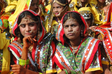 Pushkar,India,November 21,2012 - Rajasthani girls are preparing to dance perfomance at annual camel fair holiday in Pushkar,Rajasthan,India.Pushkar camel fair - one of the most popular attracitons in Indiaのeditorial素材