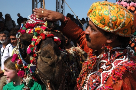 Pushkar, India,November 22,2012 -  Camel and his owner took first place at camel decoration competition at camel mela in Pushkarのeditorial素材