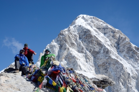 Kala Patthar,Nepal,April 23,2013 - hikers sitting at the foot of Kala Patthar mountain (5164 m )near Gorakshep village. This place is final point of the Everest Base Camp Trek,one of most popular routes in the world のeditorial素材