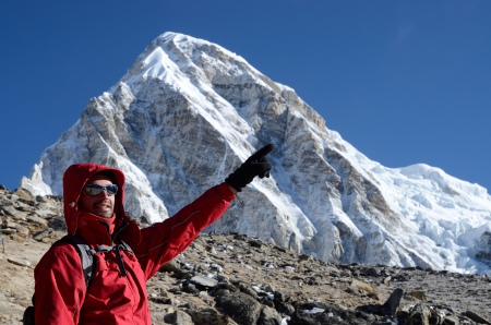 Kala Patthar,Nepal,April 22,2013 - climber near Kala Patthar mountain showing direction to Everest peak,Himalayas,Nepalのeditorial素材