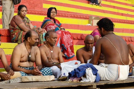 Benares,India,November 22,2013 - Brahmins  priests  perform puja - ritual ceremony at at holy ghats in Benares, India Varanasi -one of seven sacred cities in Indiaのeditorial素材