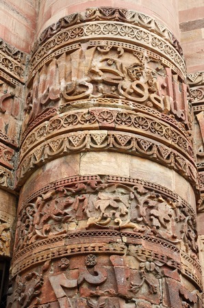 Closeup of Qutub tower in Delhi, made of red sandstone Qutb, the tallest minar in India, ancient Islamic Monument, decorated with Arabic inscriptions,  UNESCO World Heritage Siteの写真素材