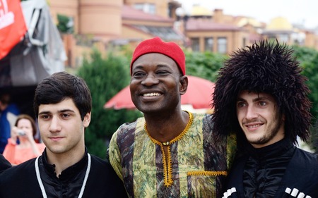 Kiev,Ukraine,May 31,2014 - African and Georgian men in traditional clothes preparing to perfomance...