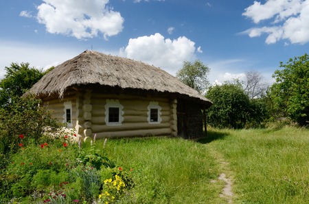 Traditional Ukrainian rural house with hay roof ,Pirogovo,Europeの写真素材