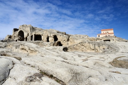 View of christian orthodox church in ancient cave town Uplistsikhe,eastern Georgia,Caucasus,Euroasiaの写真素材