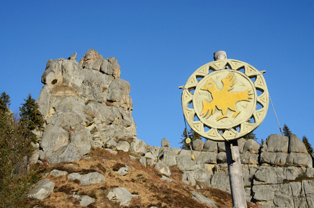URYCH,LVIV REGION,UKRAINE - DECEMBER 5, 2015 : Ethnic emblem with bird of traditional medieval culture festival in historical and cultural reserve Tustan on December 5,2015 in Carpathian mountains,Western Ukraineのeditorial素材