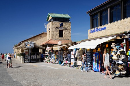 PAPHOS, CYPRUS - APRIL 20, 2016: Unidentified tourists shopping and walking at New Paphos harbour in Paphos, Cyprus on April, 20, 2016. It is island country in  Eastern Mediterranean Seaのeditorial素材